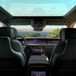 The interior of the Escalade IQL features a panoramic glass roof that floods the cabin with natural light. The view from the second row showcases the 55-inch digital display and spacious cabin that can accommodate up to seven passengers in supreme comfort.