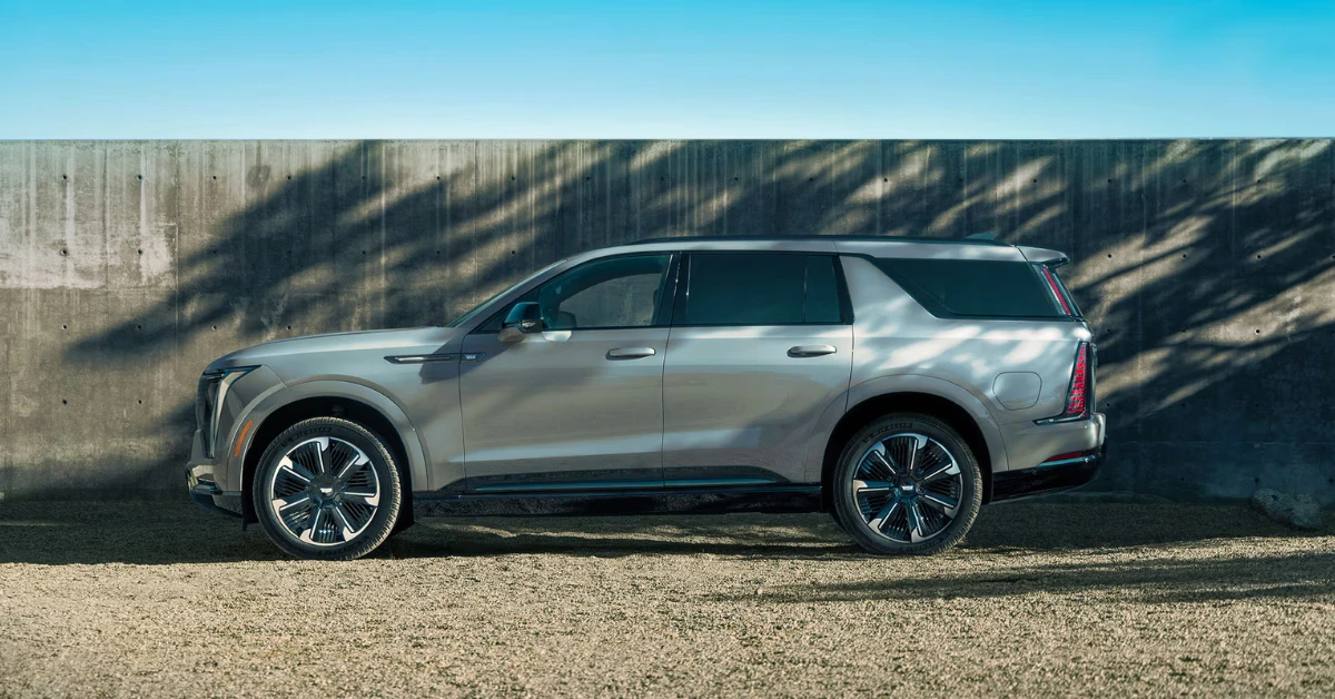 The side profile of the 2026 Escalade IQL reveals its impressive 228.5-inch length, making it one of the longest production vehicles ever. The stretched proportions accommodate more third-row legroom and additional cargo space behind the second row.