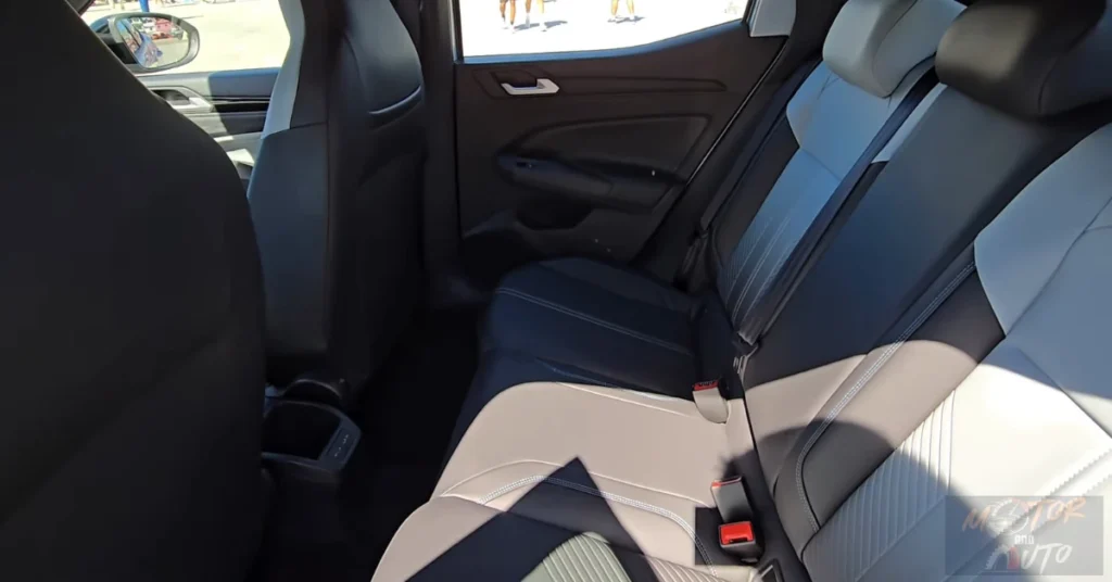 View of the VW Tera's rear seat legroom and door panel details, highlighting the compact SUV's interior space utilization.