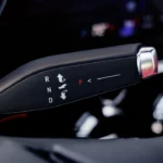 The 2025 Blazer EV features an innovative Electronic Precision Shift gear selector with a sleek design, replacing traditional gear shifters with an intuitive electronic control.