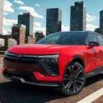 The bold 2025 Chevrolet Blazer EV SS in vibrant red showcases its distinctive front-end design with integrated LED lighting, aerodynamic profile, and sporty black accents against a dramatic city skyline.