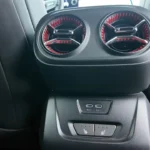 Rear passengers in the 2025 Blazer EV enjoy dedicated air vents with red accent lighting, plus USB-C ports and available heated seat controls for second-row comfort.