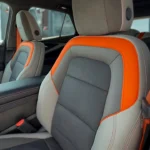 Premium perforated suede/Evotex seats in the 2025 Blazer EV SS feature distinctive orange accent panels and contrast stitching, offering both sporty aesthetics and comfort.