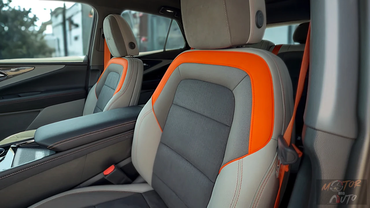 Premium perforated suede/Evotex seats in the 2025 Blazer EV SS feature distinctive orange accent panels and contrast stitching, offering both sporty aesthetics and comfort.