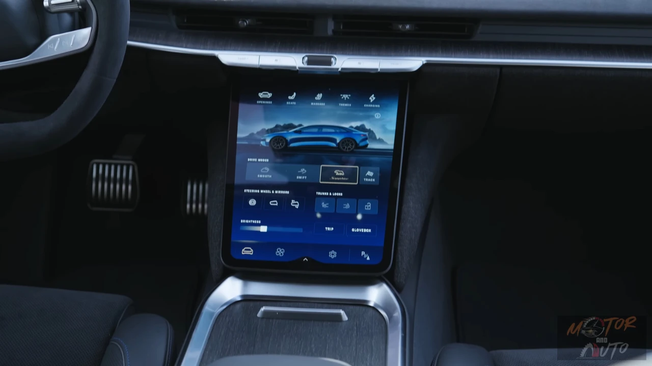 Close-up of the 2025 Lucid Air's touchscreen showing the drive mode selection interface with mode options displayed against a blue background featuring a side profile image of the car.