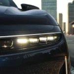 Close-up detail of the 2025 Lucid Air's advanced headlight system featuring Intelligent Micro Lens Array technology.