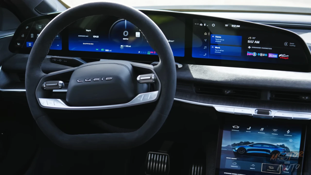 The driver-focused cockpit of the 2025 Lucid Air Sapphire model with its 34-inch curved 5K display showing vehicle information and entertainment options.