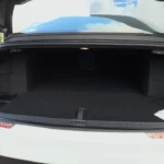 The rear trunk of the 2025 Lucid Air viewed from behind, highlighting its 22 cubic feet capacity and convenient access.