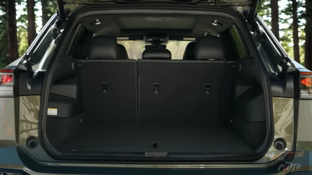 Cargo area of 2025 Volkswagen Tiguan with rear seats up showing storage capacity, tie-down points, and practical loading space