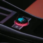 Close-up of 2025 Volkswagen Tiguan center console control knob with illuminated display showing drive mode selection