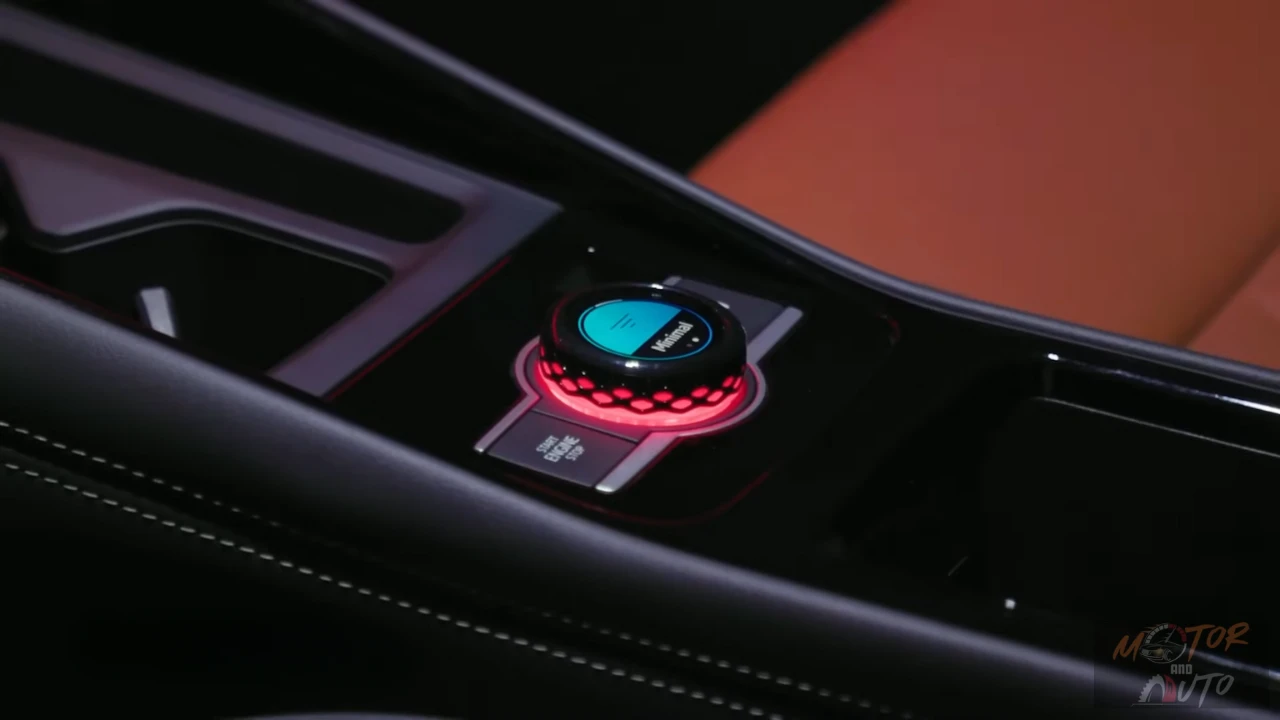 Close-up of 2025 Volkswagen Tiguan center console control knob with illuminated display showing drive mode selection