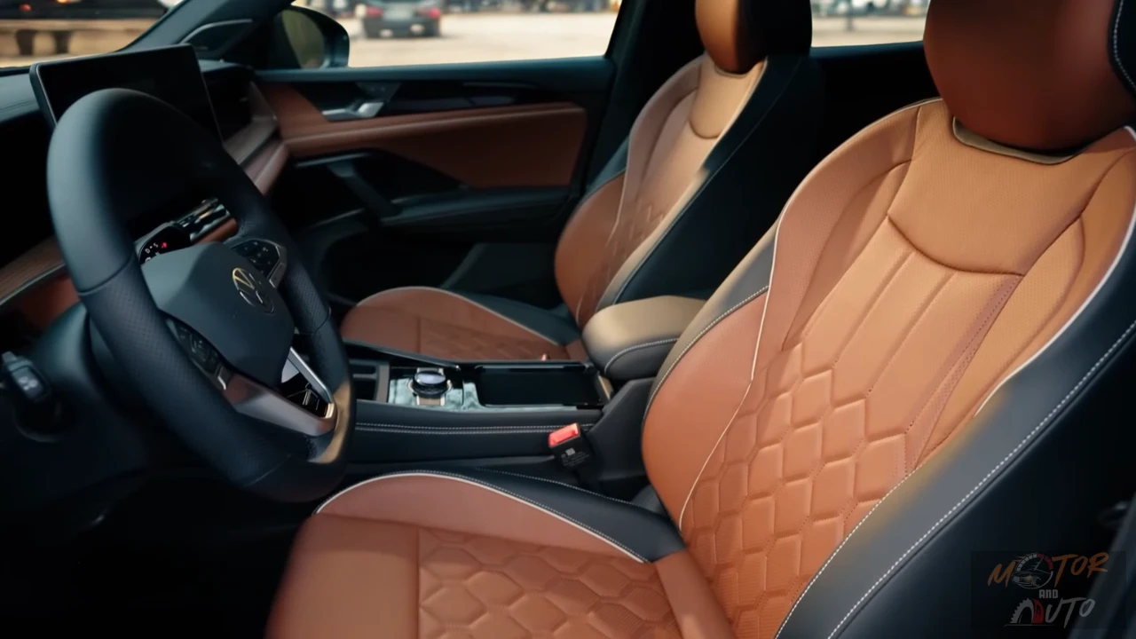 Front seats of 2025 Volkswagen Tiguan showing quilted brown leather upholstery with contrast stitching and premium seat design