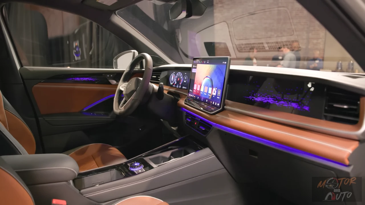 Night view of 2025 Volkswagen Tiguan interior featuring ambient lighting, wood trim, and premium materials with purple accent lighting