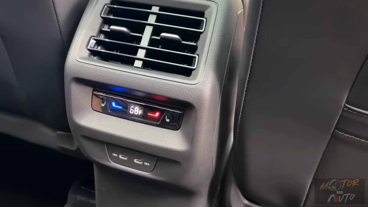 Rear climate control panel in 2025 Volkswagen Tiguan showing temperature display, heated seat controls, and air vents
