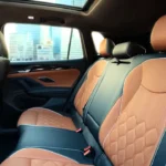 The spacious rear seats offer 40.2 inches of legroom with heated seating on the top trim, premium leather upholstery matching the front, and an expansive panoramic sunroof creating an airy cabin feel.