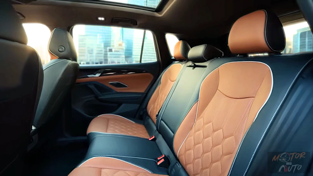 The spacious rear seats offer 40.2 inches of legroom with heated seating on the top trim, premium leather upholstery matching the front, and an expansive panoramic sunroof creating an airy cabin feel.