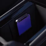 Smartphone charging wirelessly in 2025 Volkswagen Tiguan charging compartment with ventilation cooling system