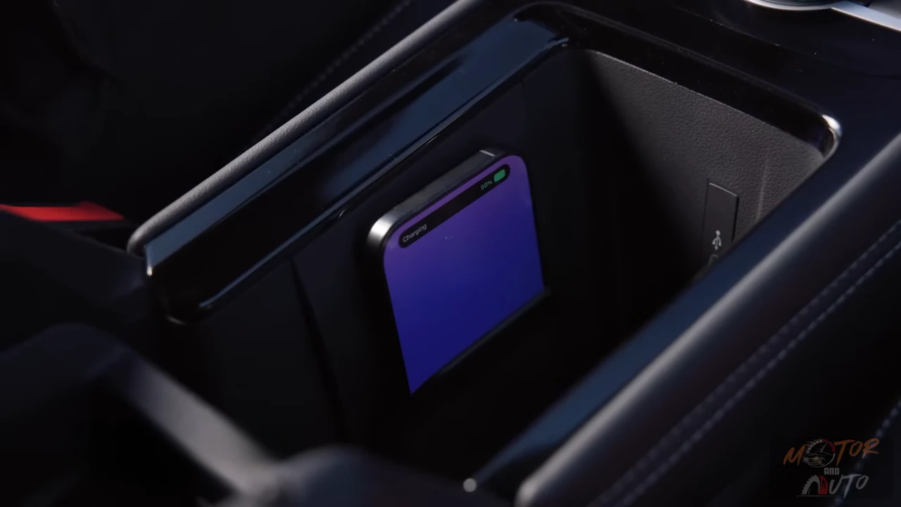Smartphone charging wirelessly in 2025 Volkswagen Tiguan charging compartment with ventilation cooling system