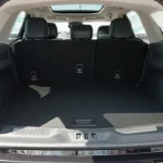 Cargo area of 2025 Lincoln Nautilus showing spacious storage capacity with power liftgate opening and practical loading space for luggage and cargo