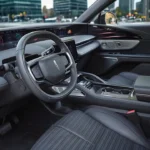 Interior dashboard view of 2025 Lincoln Nautilus showing the massive 48-inch curved display screen spanning across the dashboard, black leather seats, and modern Lincoln Digital Experience interface