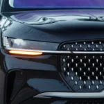 Detailed view of 2025 Lincoln Nautilus LED headlight assembly with illuminated amber turn signal, multi-projector beam pattern, and integrated daytime running light strip