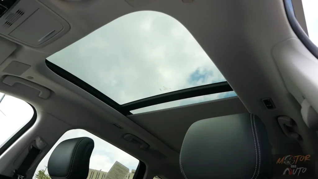 Interior view looking up at the panoramic sunroof of 2025 Lincoln Nautilus showing the large glass opening and interior headliner details