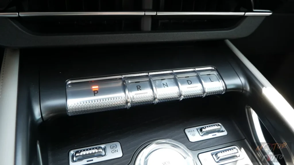 Piano key style transmission shifter in 2025 Lincoln Nautilus showing P, R, N, D, L buttons with premium metallic finish and surrounding control buttons