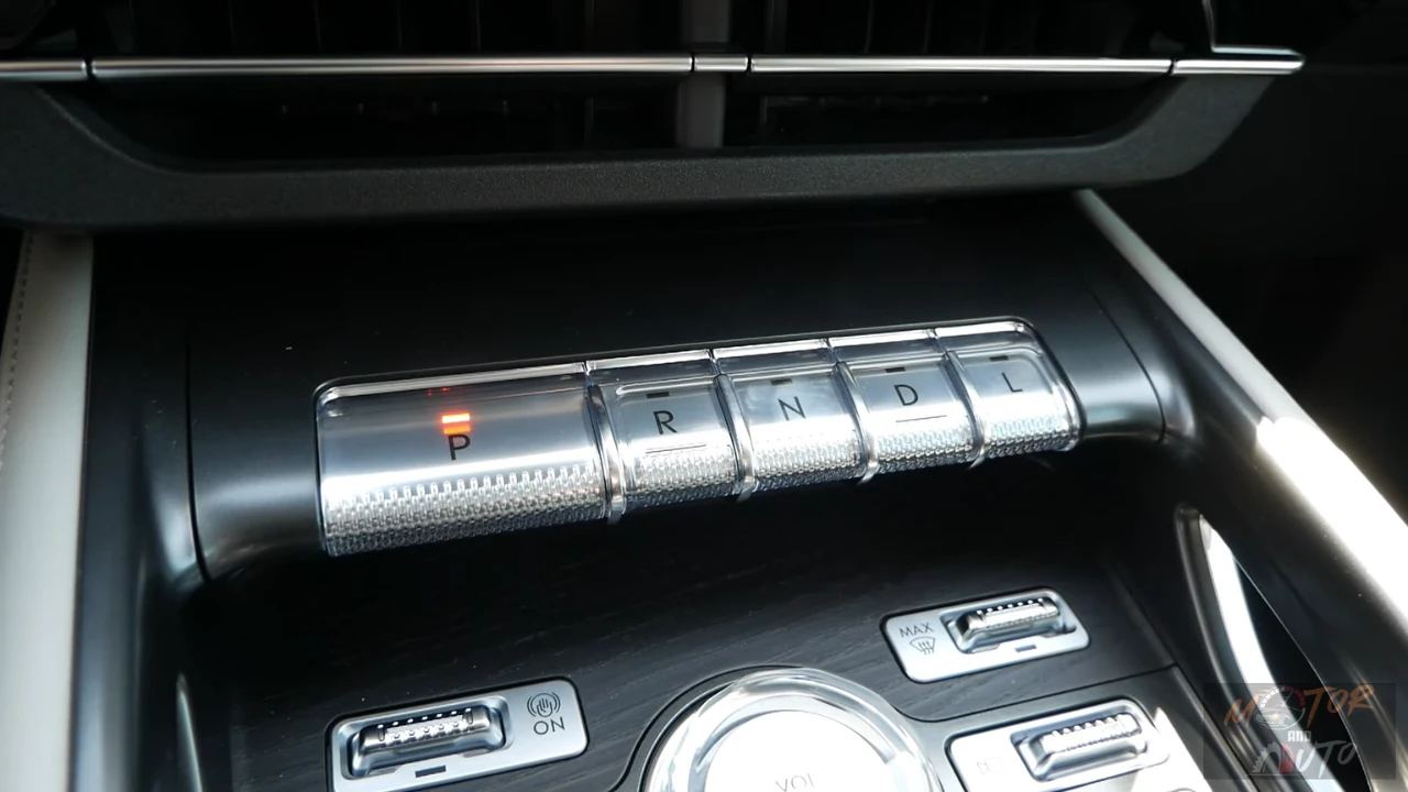 Piano key style transmission shifter in 2025 Lincoln Nautilus showing P, R, N, D, L buttons with premium metallic finish and surrounding control buttons