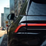 Detailed close-up of 2025 Lincoln Nautilus rear LED taillight showing illuminated red light elements, sequential turn signal pattern, and premium light signature design