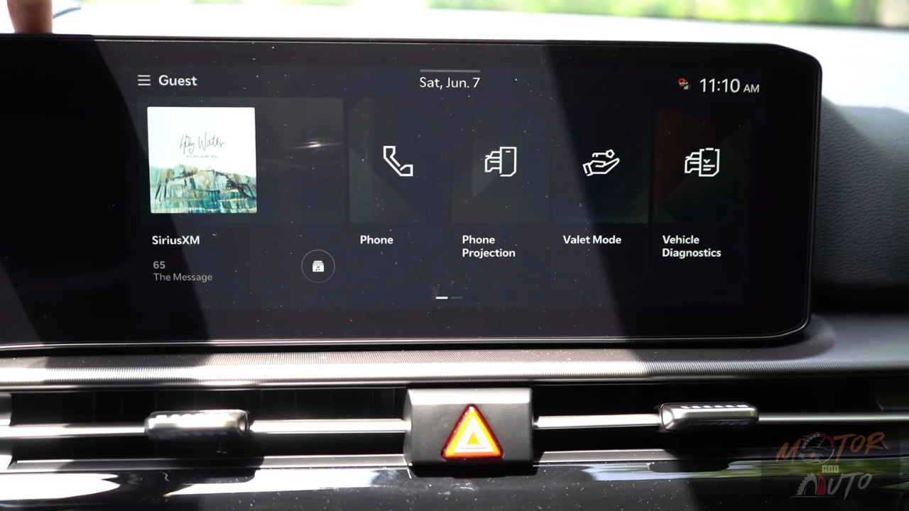 Infotainment home screen of 2026 Kia Sportage showing widget layout with SiriusXM, phone, phone projection, valet mode, and vehicle diagnostics options