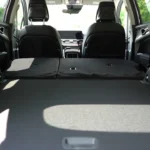 Interior cargo view of 2026 Kia Sportage with rear seats folded down showing maximum 74.1 cubic feet of storage space and flat loading floor