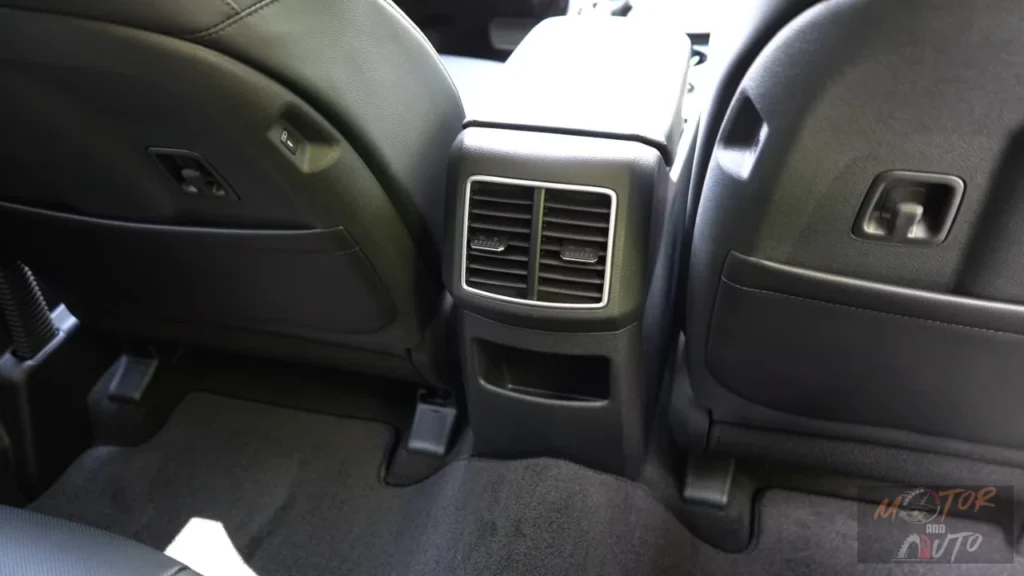 Rear seat area of 2026 Kia Sportage showing air vents, storage compartments, and passenger comfort features for second-row occupants