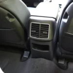 Rear seat area of 2026 Kia Sportage showing air vents, storage compartments, and passenger comfort features for second-row occupants