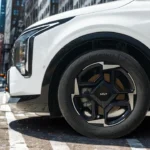 Close-up view of 2026 Kia Sportage alloy wheel showing modern spoke design with Continental EcoContact tire and Kia center cap branding
